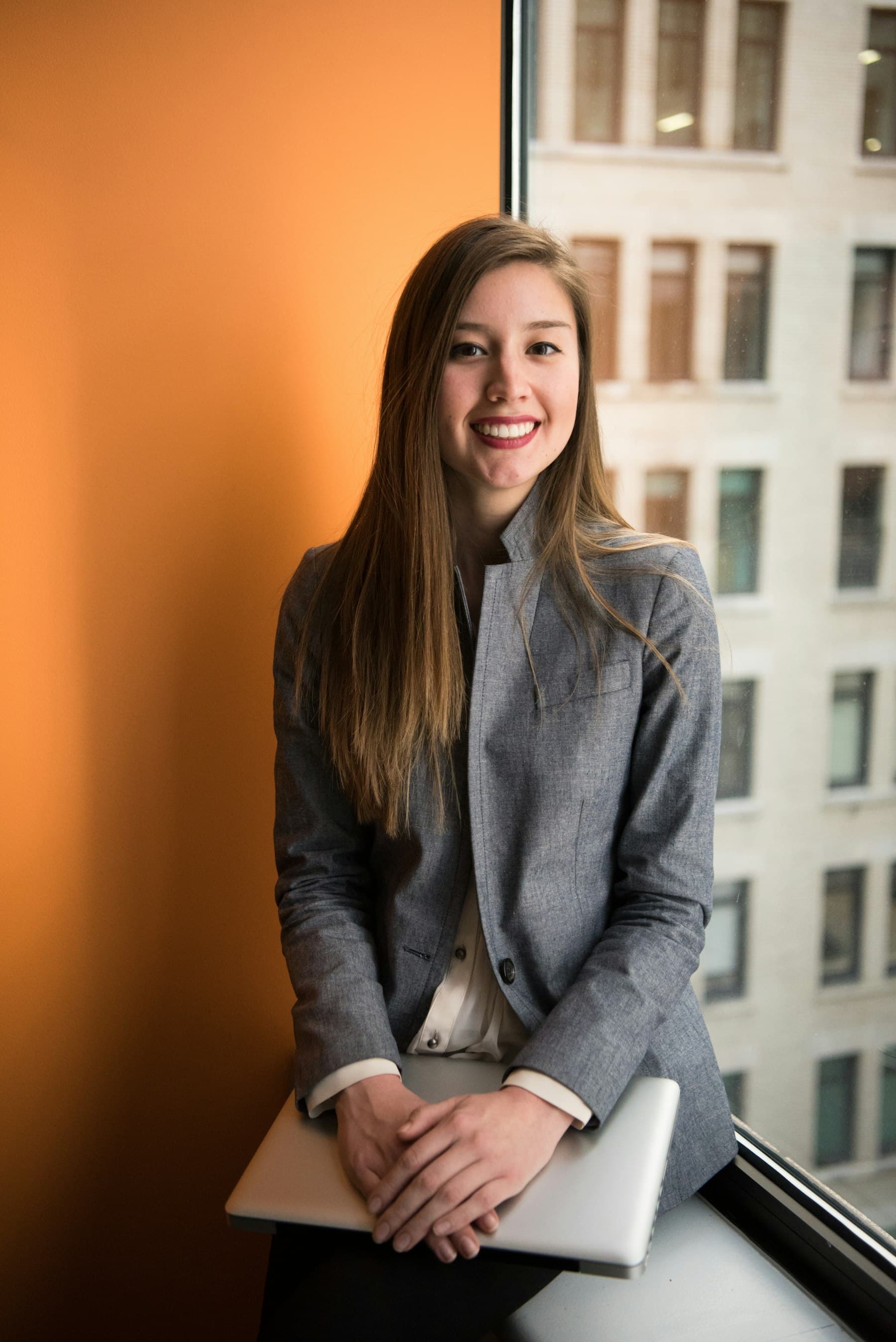 A person standing by an office window